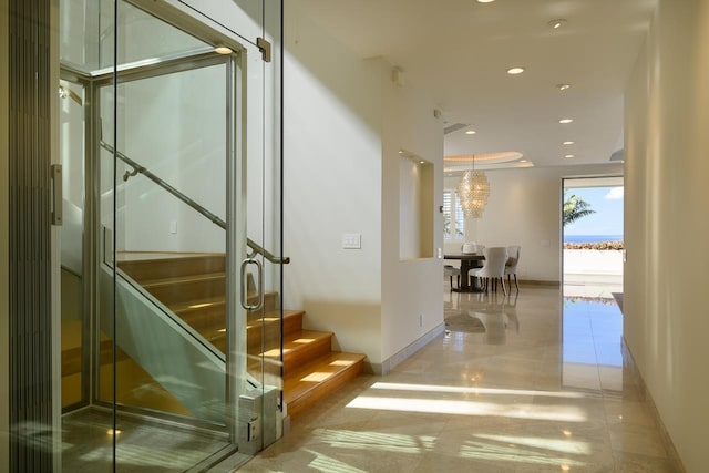 hallway featuring light tile patterned floors