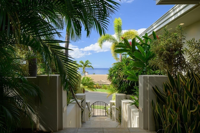 view of patio with a water view