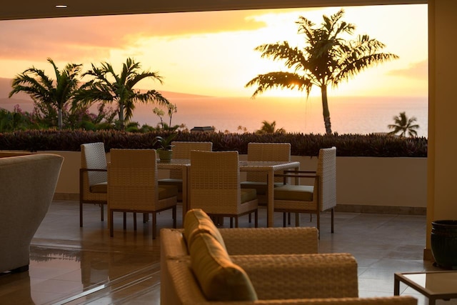 patio terrace at dusk with a water view