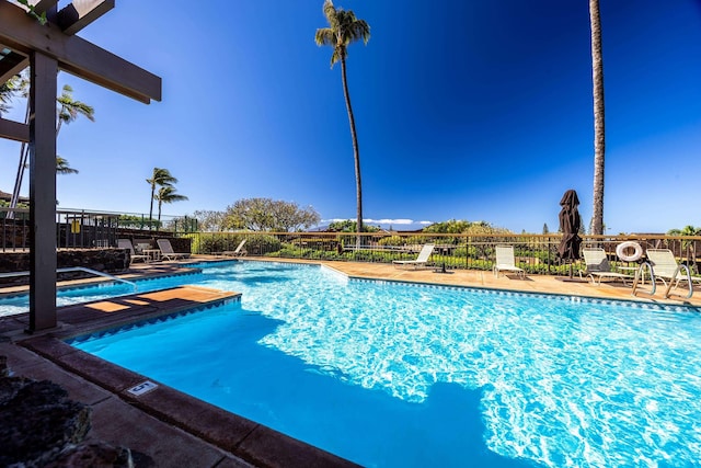 view of pool featuring a hot tub