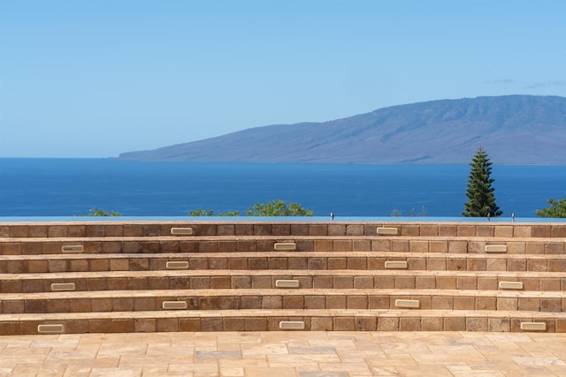 view of mountain feature with a water view