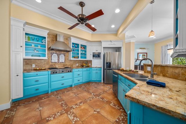 kitchen with white cabinetry, sink, wall chimney exhaust hood, blue cabinets, and appliances with stainless steel finishes