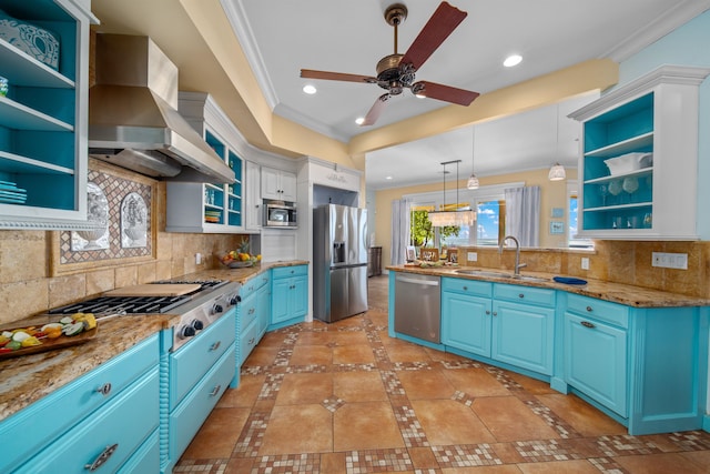 kitchen with appliances with stainless steel finishes, sink, tasteful backsplash, and wall chimney range hood