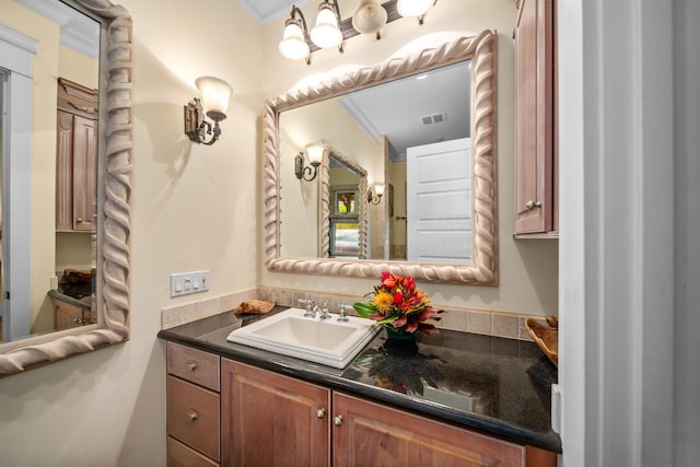 bathroom featuring vanity and crown molding