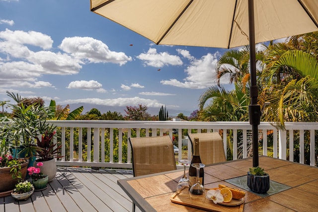 wooden terrace featuring outdoor dining space