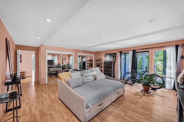 bedroom with recessed lighting, light wood-type flooring, and beamed ceiling