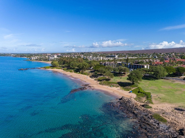 birds eye view of property featuring a water view and a view of the beach