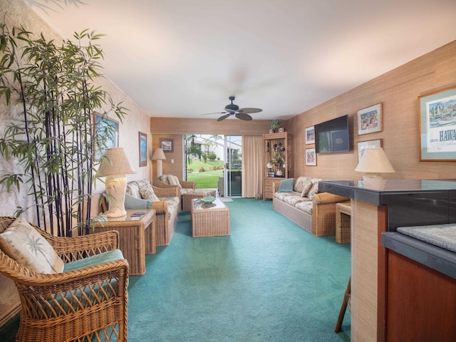 carpeted living room with ceiling fan