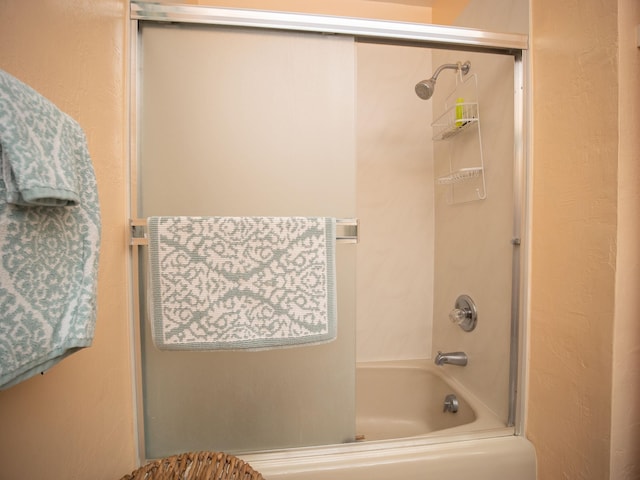 bathroom with washtub / shower combination