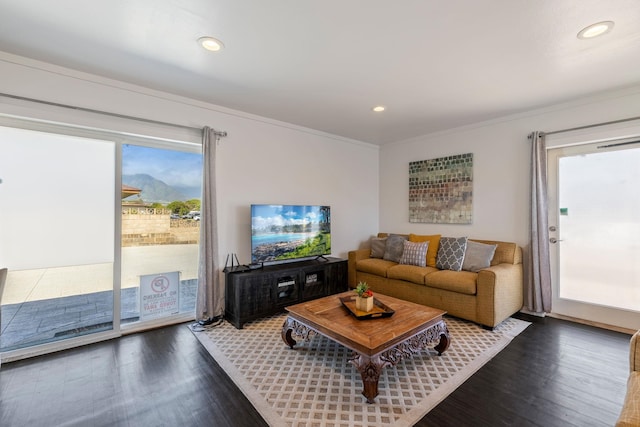 living area featuring recessed lighting, wood finished floors, and ornamental molding