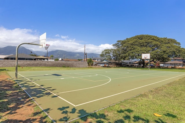 view of basketball court featuring a mountain view and community basketball court