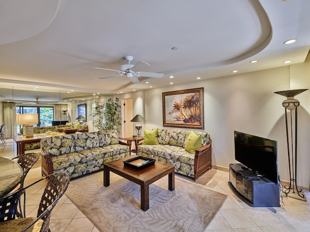 tiled living room with ceiling fan