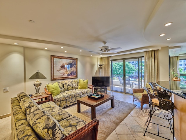 living room featuring ceiling fan and light tile patterned floors