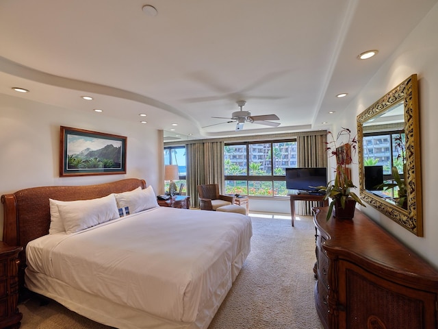 carpeted bedroom featuring ceiling fan