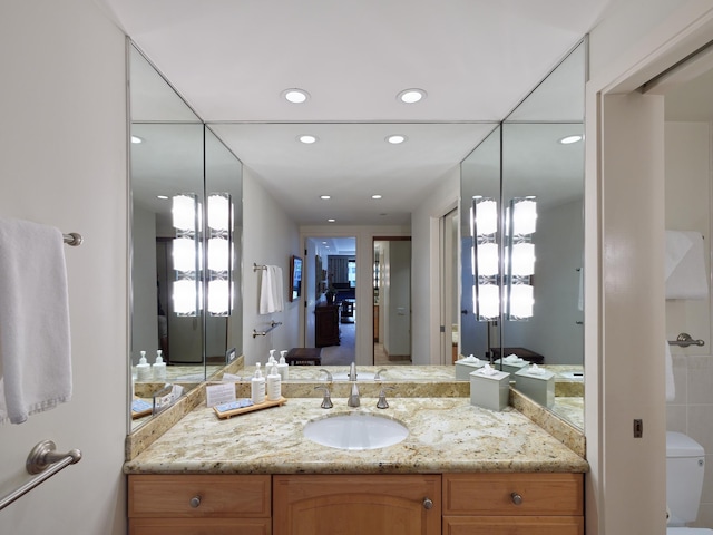 bathroom featuring vanity and toilet