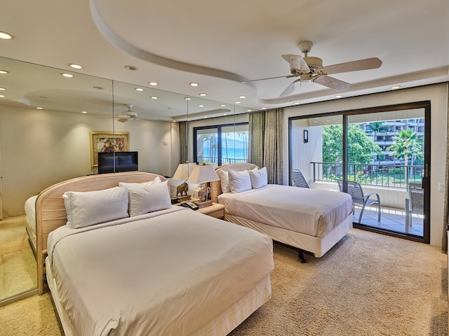 carpeted bedroom featuring ceiling fan and access to outside