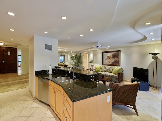 kitchen with stainless steel dishwasher, ceiling fan, sink, light brown cabinets, and light tile patterned floors