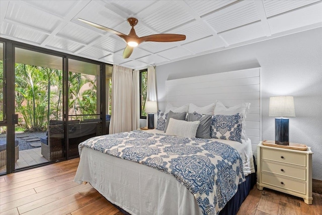 bedroom with access to outside, ceiling fan, light wood-type flooring, and floor to ceiling windows