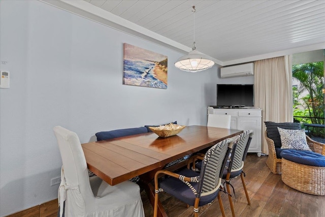 dining room featuring an AC wall unit and dark hardwood / wood-style flooring