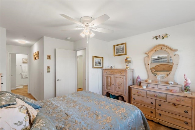 bedroom with ceiling fan and light hardwood / wood-style flooring