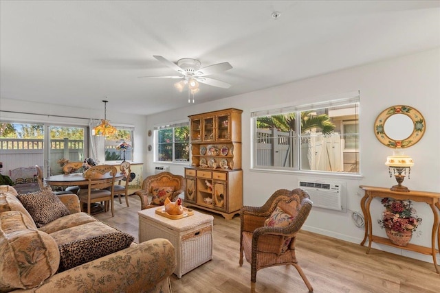 sunroom with an AC wall unit, a wealth of natural light, and ceiling fan