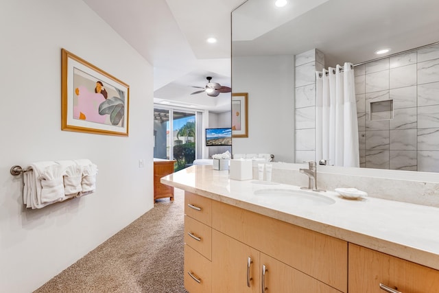 bathroom with a shower with curtain, ceiling fan, and vanity