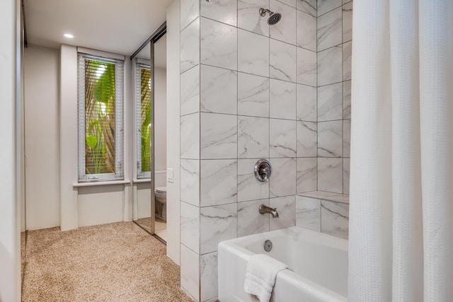 bathroom with toilet and shower / tub combo with curtain