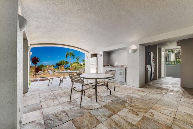 view of patio with area for grilling and sink