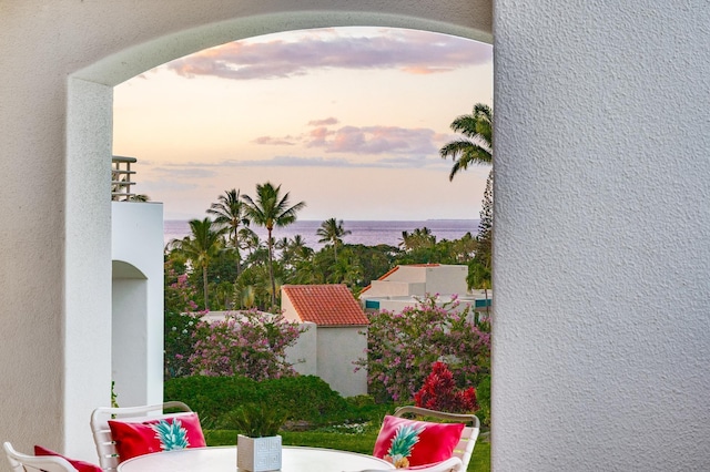 patio terrace at dusk with a water view