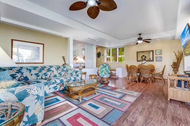 living room with hardwood / wood-style flooring and ceiling fan