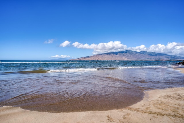 water view featuring a mountain view and a view of the beach