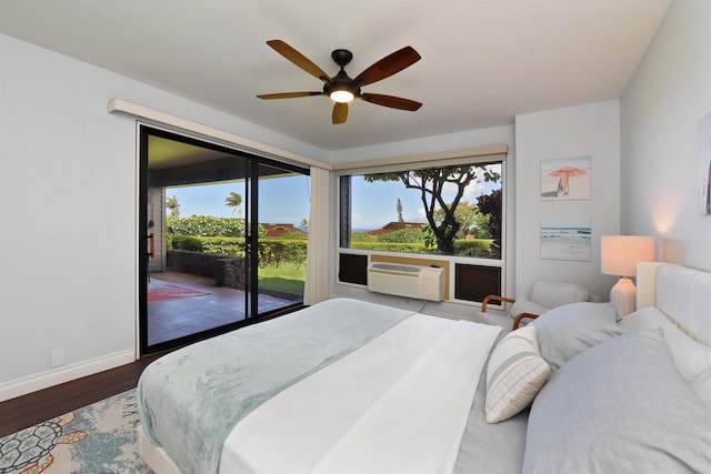 bedroom featuring hardwood / wood-style floors, access to outside, ceiling fan, and cooling unit