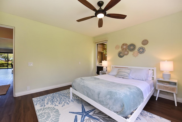 bedroom with ceiling fan and dark wood-type flooring