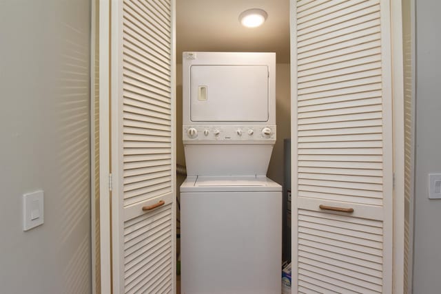 laundry area featuring stacked washing maching and dryer