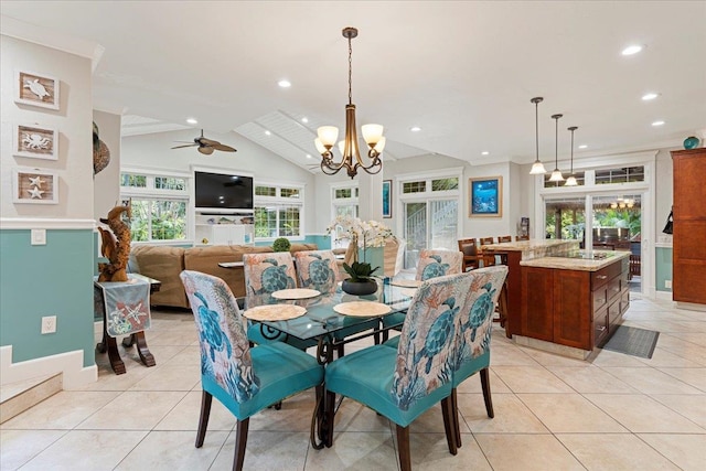 dining space featuring vaulted ceiling, ceiling fan with notable chandelier, and light tile patterned floors