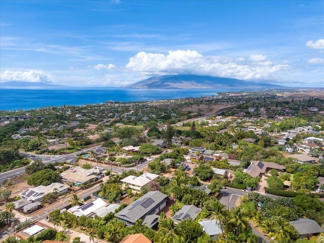 drone / aerial view with a water and mountain view