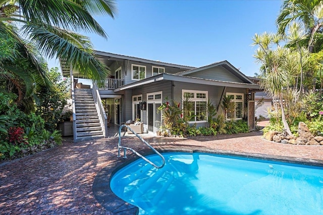 view of pool featuring a patio