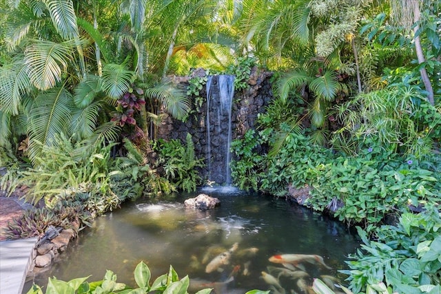 exterior details featuring a small pond