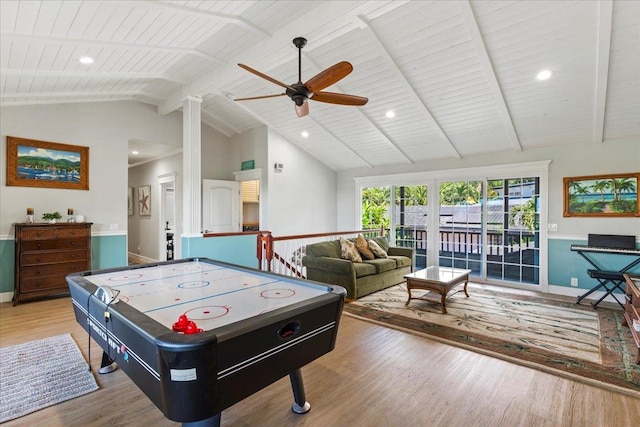 game room featuring wood ceiling, beamed ceiling, wood-type flooring, and ceiling fan