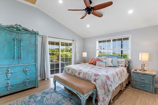 bedroom featuring light hardwood / wood-style flooring, lofted ceiling, multiple windows, and ceiling fan