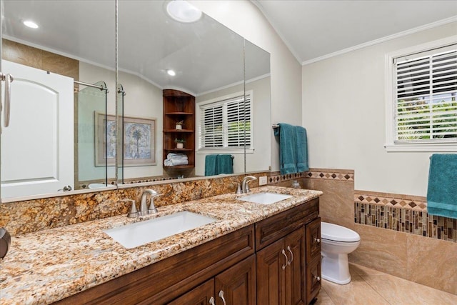 440 Mikioi Pl, Kihei, HI 96753 - bathroom featuring tile walls, crown molding, toilet, a shower with shower door, and double vanity