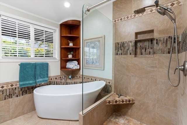 bathroom featuring tile walls, tile patterned floors, separate shower and tub, and crown molding