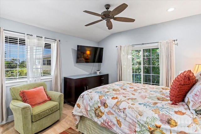 bedroom featuring vaulted ceiling, light hardwood / wood-style flooring, and ceiling fan