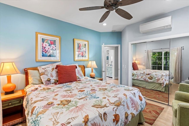 bedroom featuring a wall mounted air conditioner, a closet, light hardwood / wood-style floors, and ceiling fan