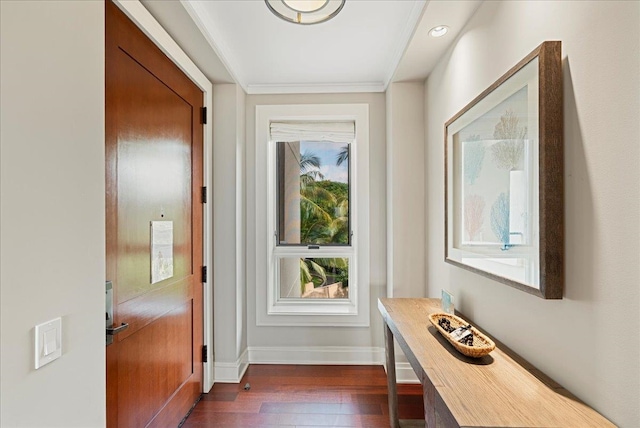 doorway with dark wood-type flooring and baseboards