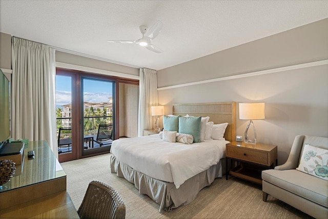 bedroom with access to outside, light colored carpet, ceiling fan, and a textured ceiling