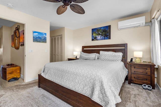 bedroom featuring ceiling fan, a closet, light carpet, and a wall mounted air conditioner