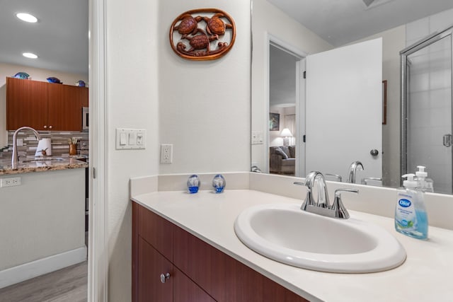 bathroom with vanity and wood-type flooring