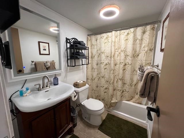 full bathroom with vanity, tile patterned floors, toilet, and shower / tub combo with curtain