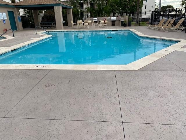 view of swimming pool featuring a patio